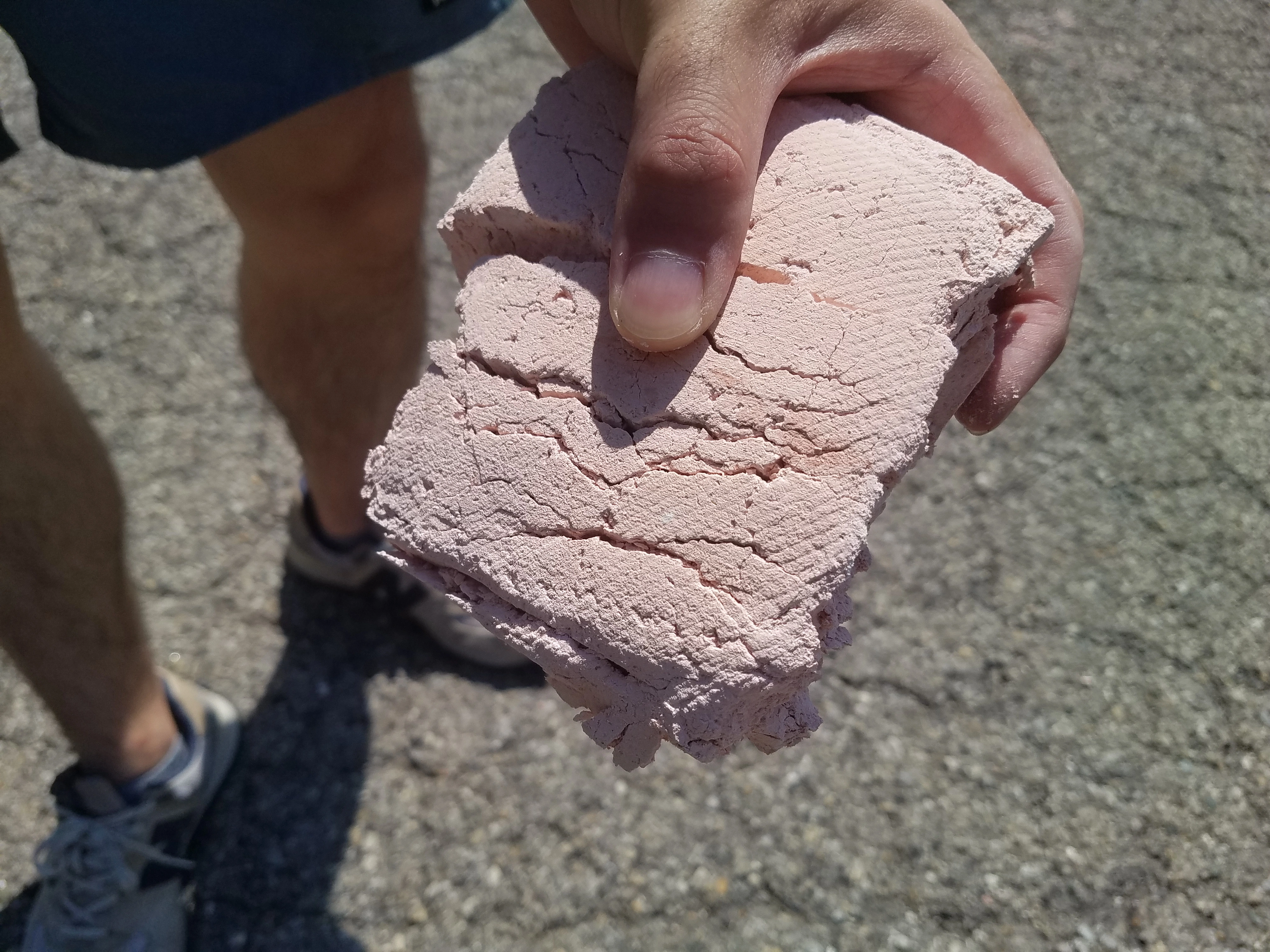 Damaged binders only brick sample with large cracks after the pressure test.