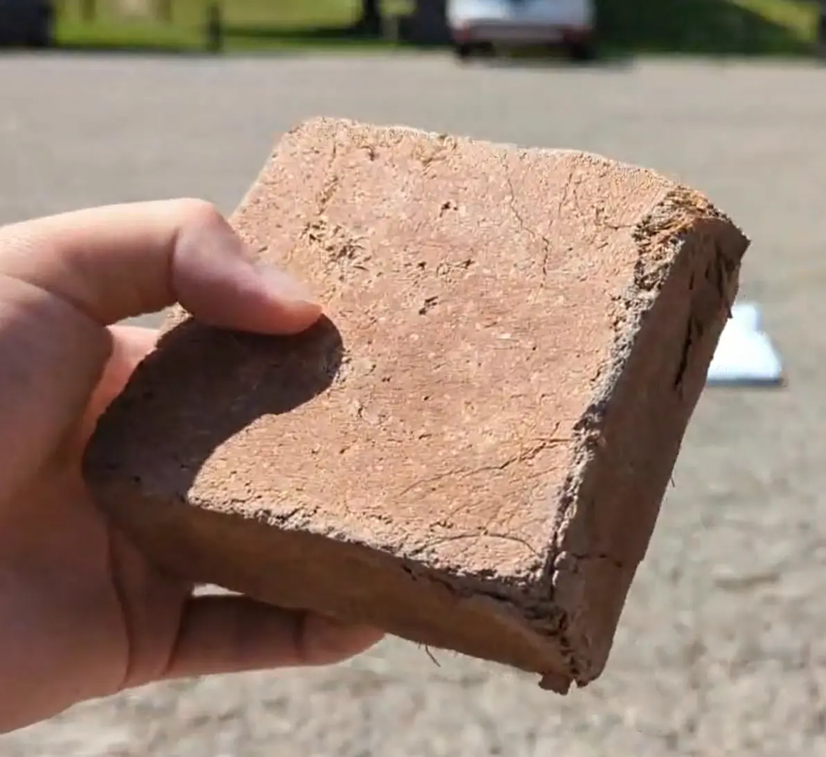 Coconut brick sample with binders and coconut ingredients holding its shape after the pressure test.