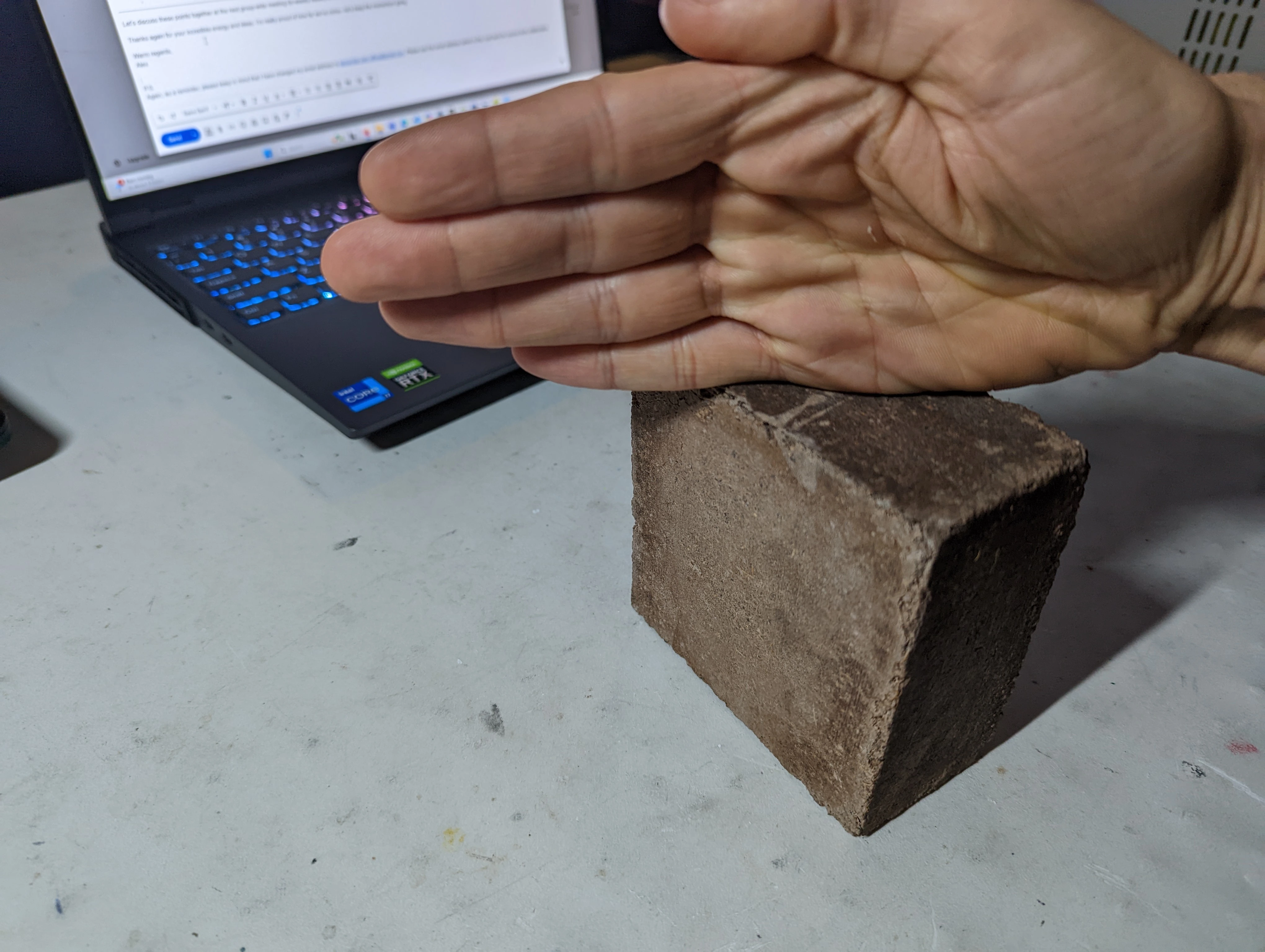 First coconut brick prototype formed from discarded coconut materials.