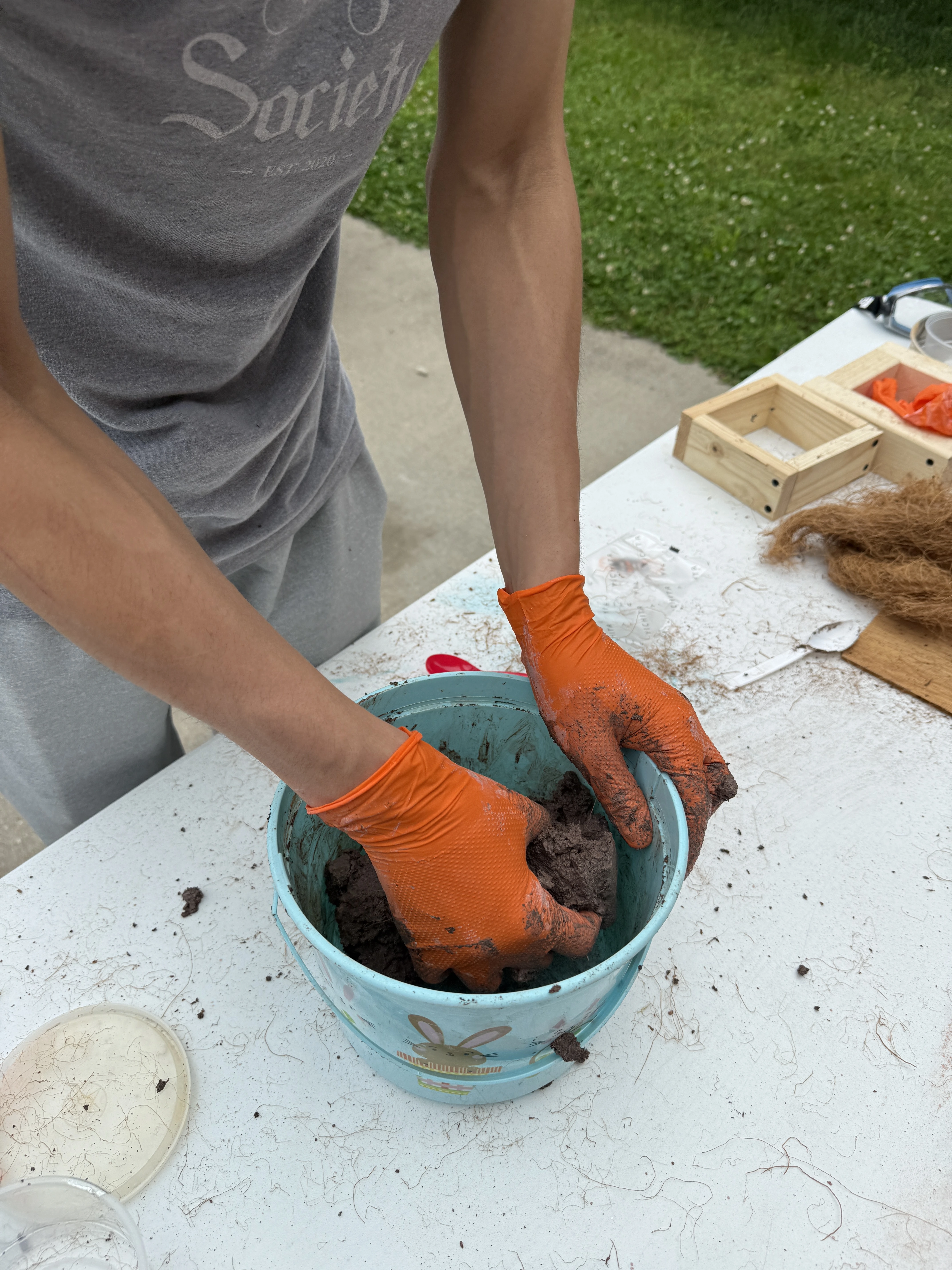 Ingredients being mixed during coconut brick prototyping.