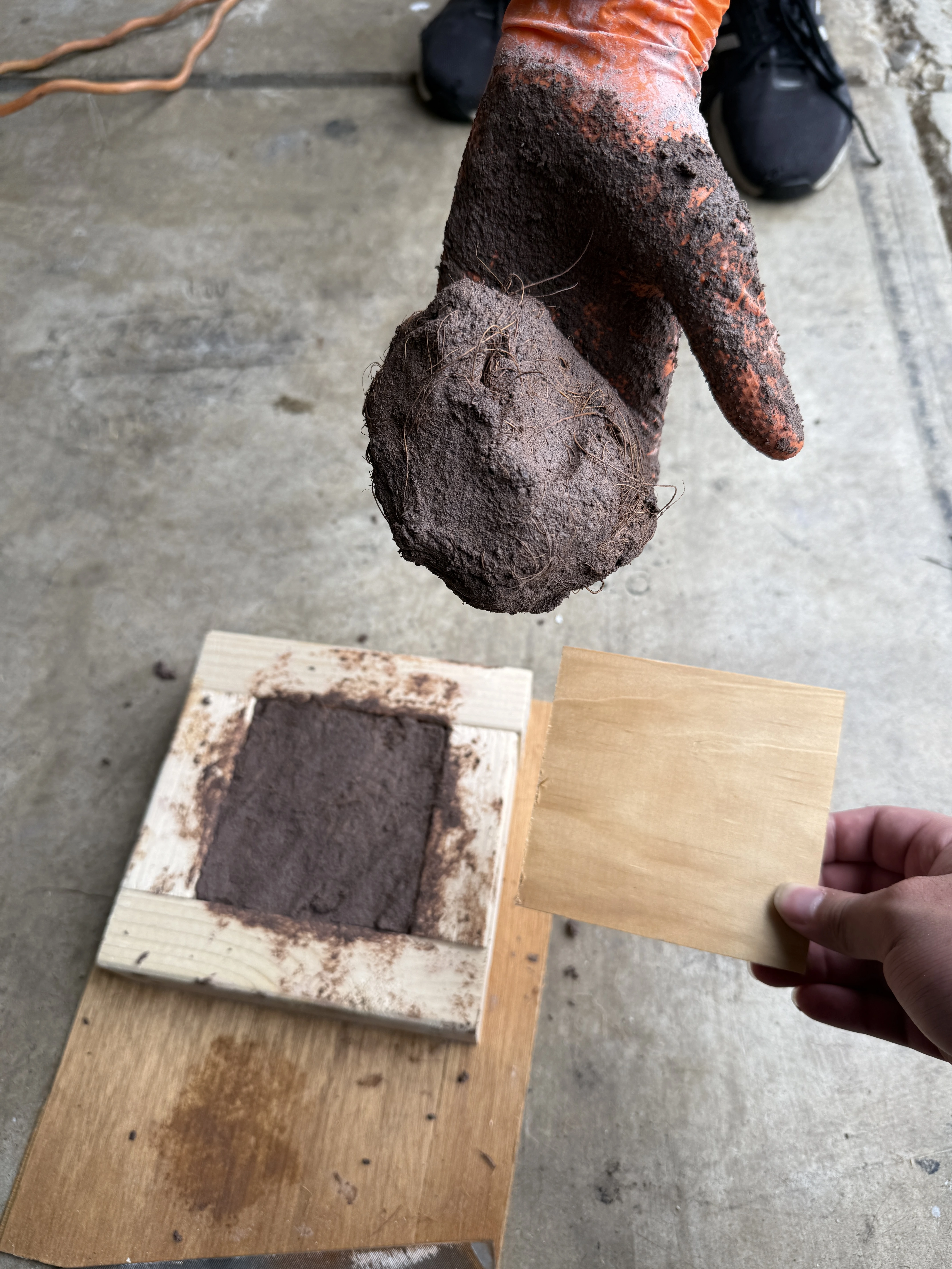 Mold used to shape coconut brick prototypes during experimentation.