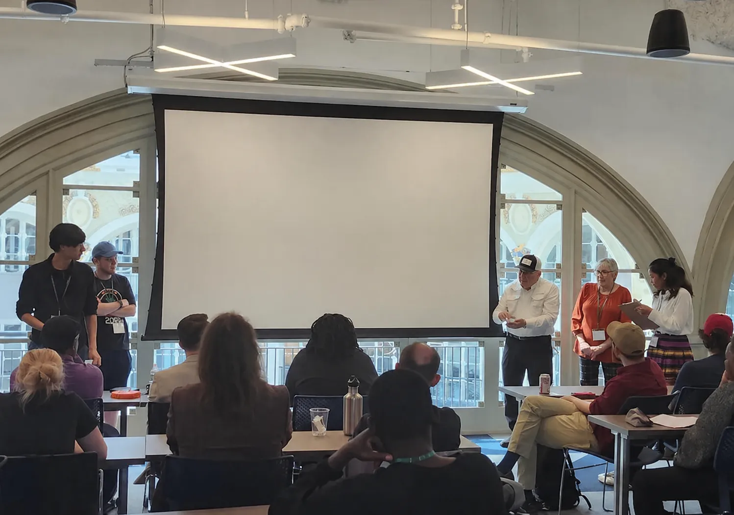 Team presenting their project during a startup pitch competition.